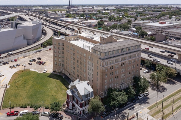 arial view of an apartment complex with green grass